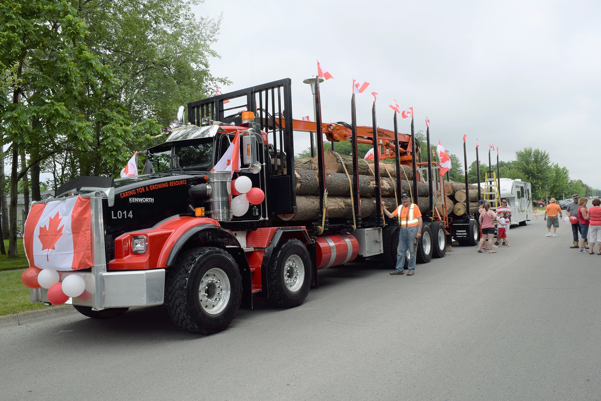 Townsend lumber truck covered in red and white balloons for Canada Day.