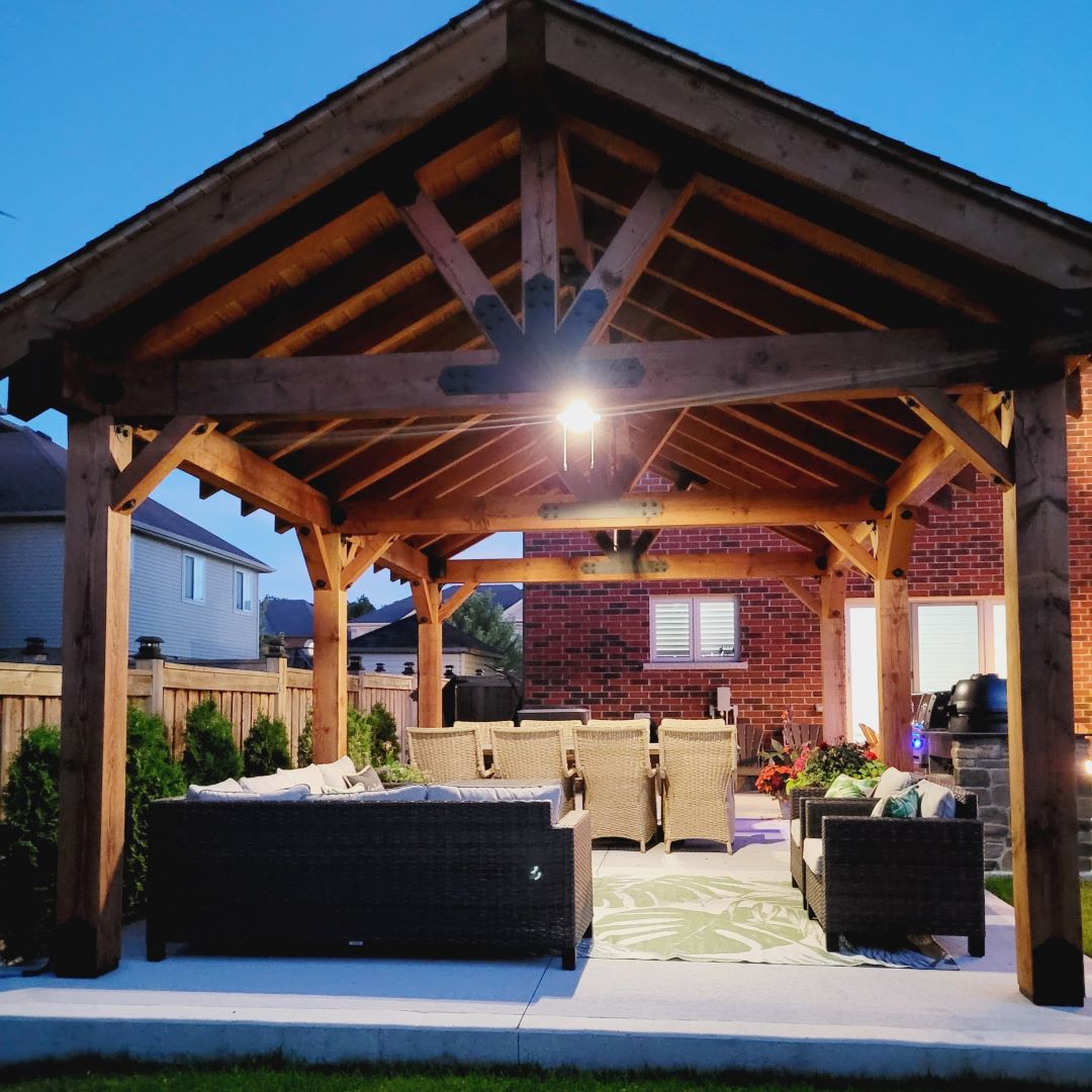 Pergola at night with a light underneath it